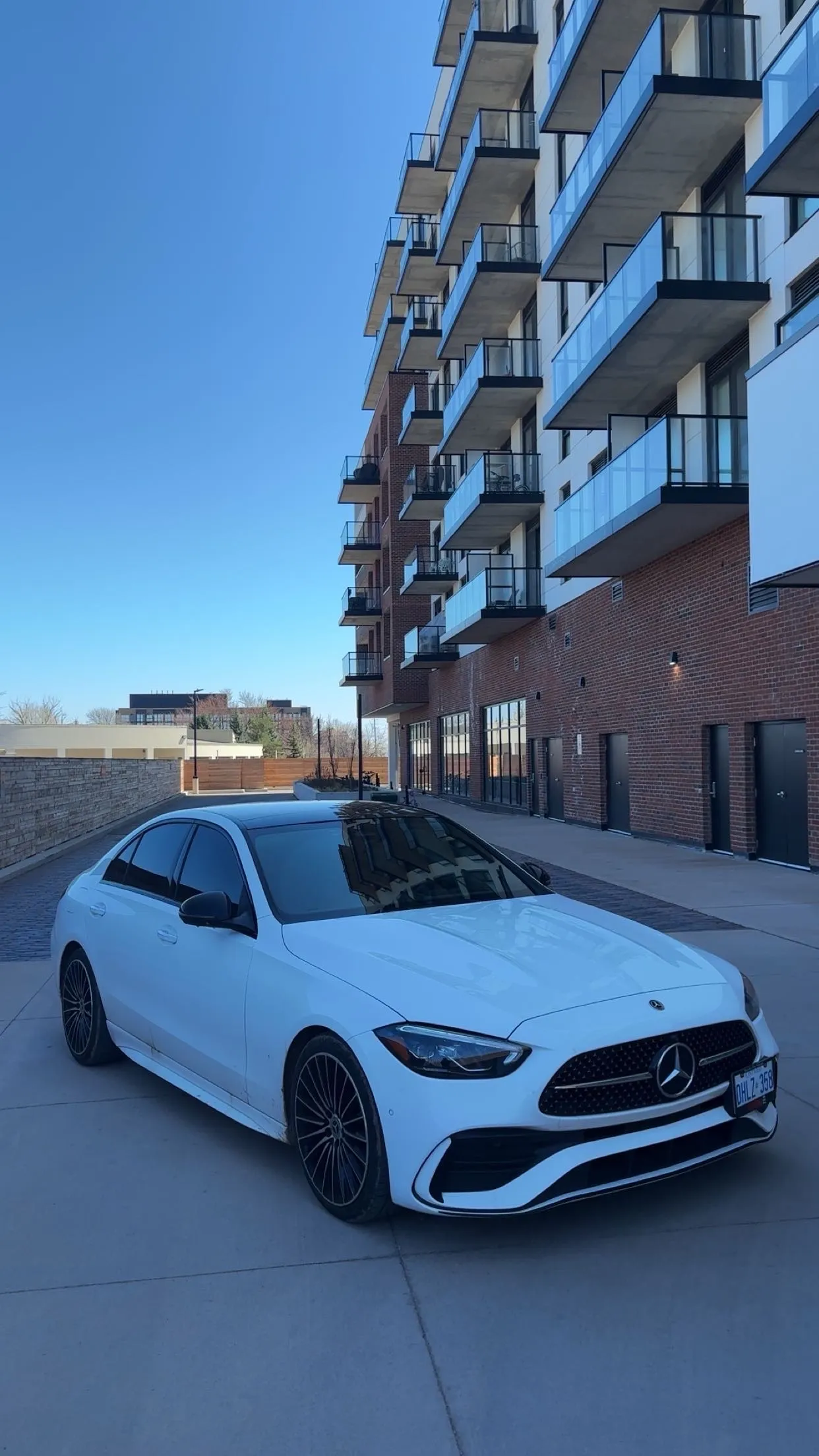 White sedan exterior detail — paint correction and ceramic coating, Toronto